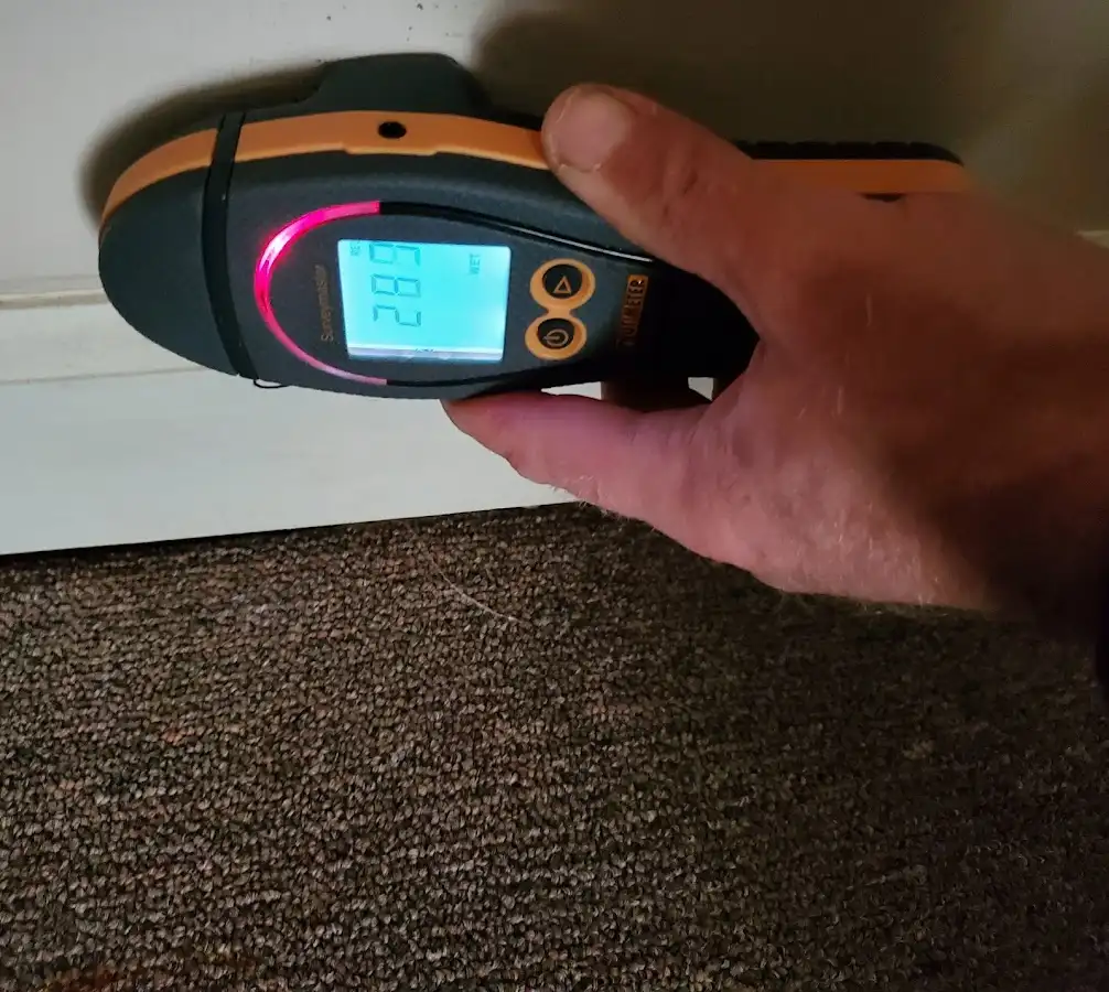 Moisture detection at baseboard during Storm Damage Restoration in Parma